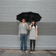 Illustration for article titled Tandem Umbrella For Clingy Couples